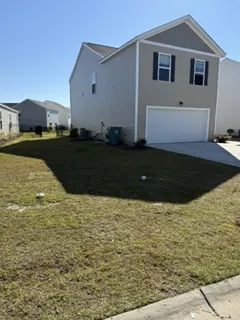 After: curbside junk pile in front of a Myrtle Beach area home removed by Moose Junk Removal