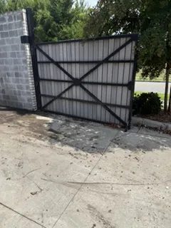 After: mattresses, couch and furniture stacked by a fence removed by Moose Junk Removal