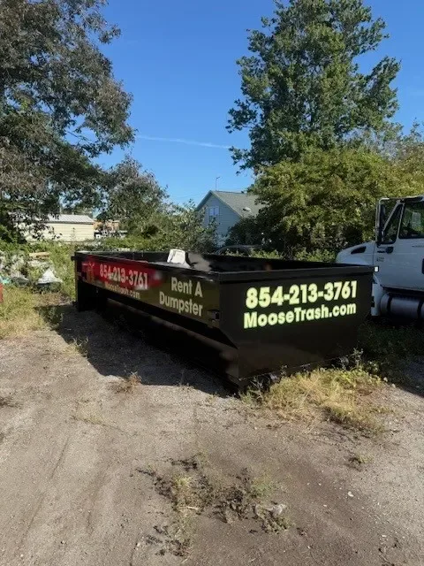 Moose Junk Removal 15-yard roll-off rental dumpster — call or text 854-213-3761 or book at MooseTrash.com